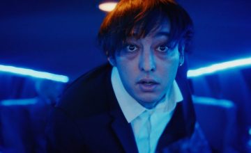 Joji literally runs from fame in his new music video
